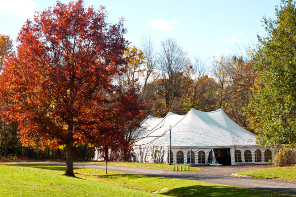 Large white party tent set up outside