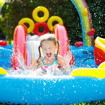 Party & Event RentalsGirl sliding down an inflatable water slide